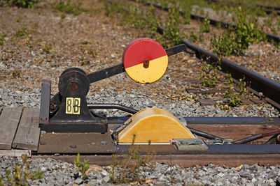 High angle view of road sign on railroad track