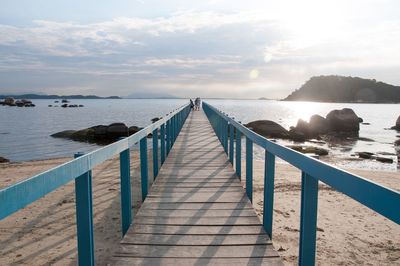 Pier over sea against sky