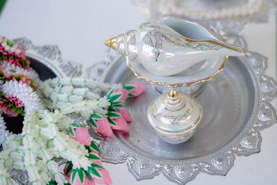 Close-up of wedding rings on table