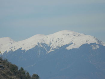 Scenic view of snow mountains against sky