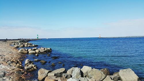 Scenic view of calm sea against blue sky