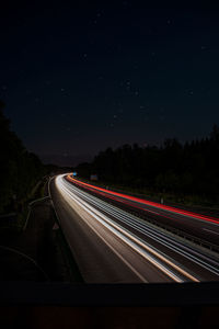 Light trails on road at night