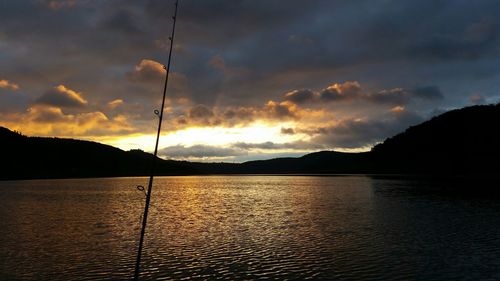 Scenic view of lake against cloudy sky