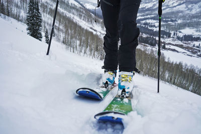 Close up of boots and skis while person skins uphill in colorado.