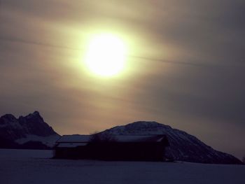 Scenic view of snow covered mountains against sky