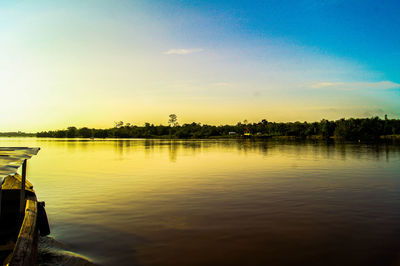 Scenic view of lake at sunset