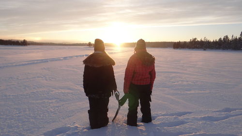 People on snow covered landscape