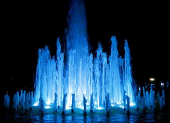 Panoramic view of illuminated water at night