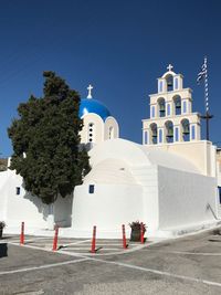 View of white building against blue sky