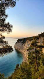 Scenic view of sea against clear sky during sunset