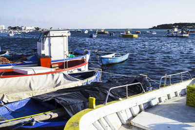 Boats in sea against sky