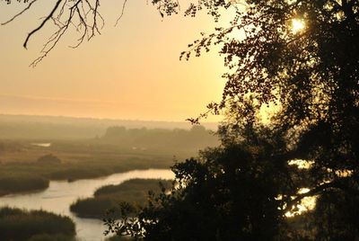 Scenic view of landscape at sunset