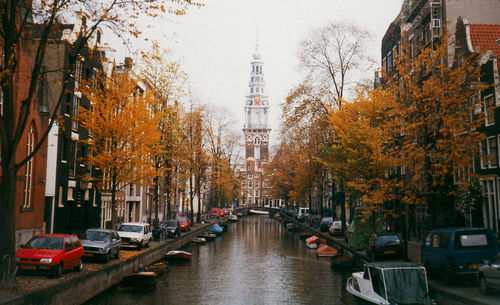 Canal along buildings in city