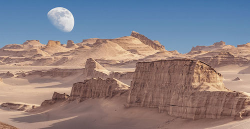 Scenic view of rocky mountains against clear sky