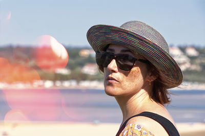 Portrait of young woman wearing hat