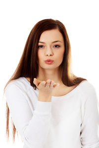 Portrait of beautiful young woman over white background