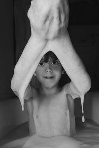 Portrait of shirtless boy at home