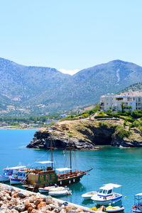 Sailboats moored in bay