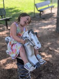 Happy girl with arms raised