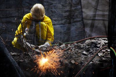 Worker welding at construction site