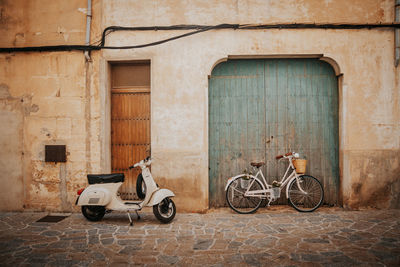 Bicycles on street against old building