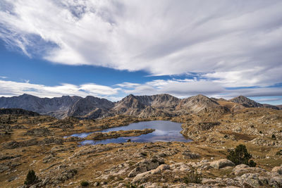 Scenic view of landscape and mountains against sky