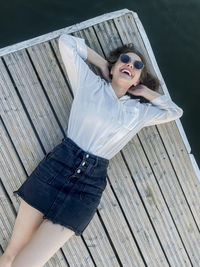 Portrait of young woman wearing sunglasses outdoors