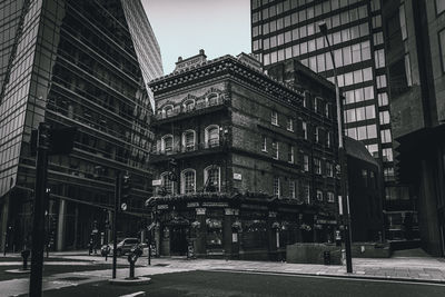 The albert public house in westminster, surrounded by skyscrapers in black and white