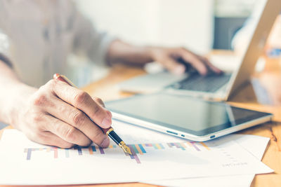 Close-up of woman working on table