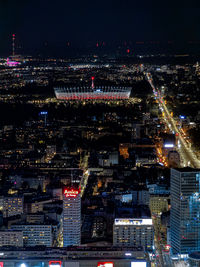 High angle view of illuminated buildings in city at night