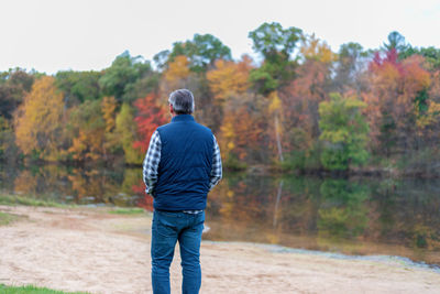 Rear view of man standing on rock