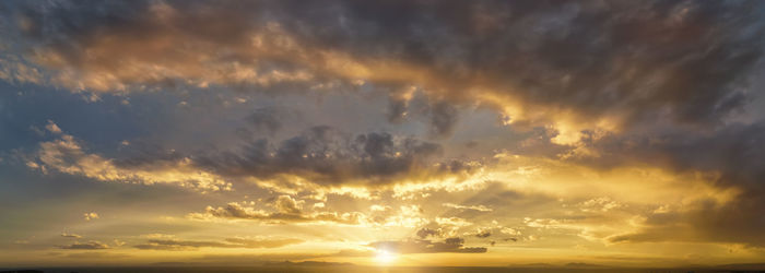 Low angle view of dramatic sky during sunset