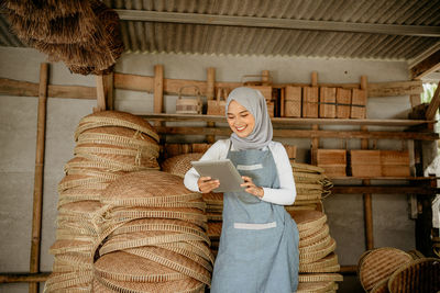 Low angle view of woman standing at home