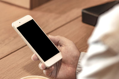 Close-up of hand holding smart phone
