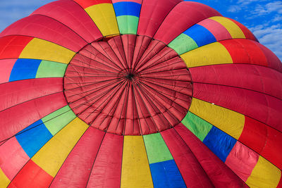 Low angle view of hot air balloon flying against sky