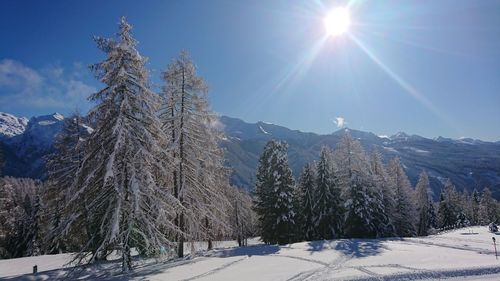 Scenic view of snow covered mountains against sky