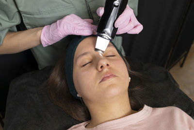 Portrait of smiling young woman using mobile phone