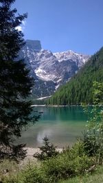 Scenic view of lake and mountains against clear sky