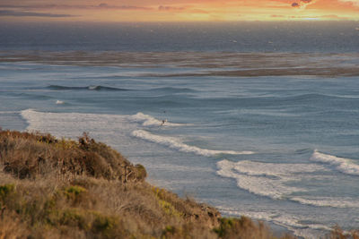 Scenic view of sea against sky during sunset