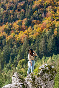 Full length of a man standing on rock