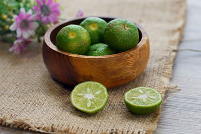 Close-up of green fruits on table