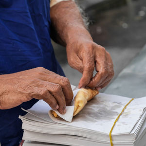 Close-up of man preparing food