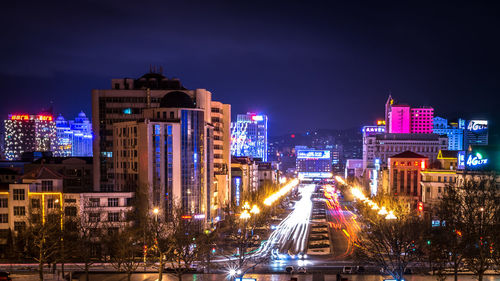 Light trails on road in city at night