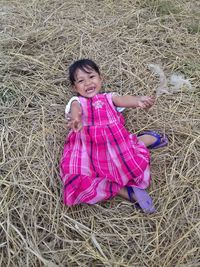 Portrait of smiling girl on field