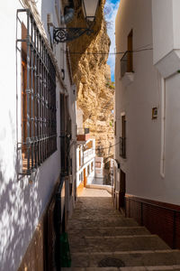 Narrow alley amidst buildings in city