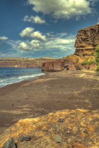 Scenic view of beach against sky