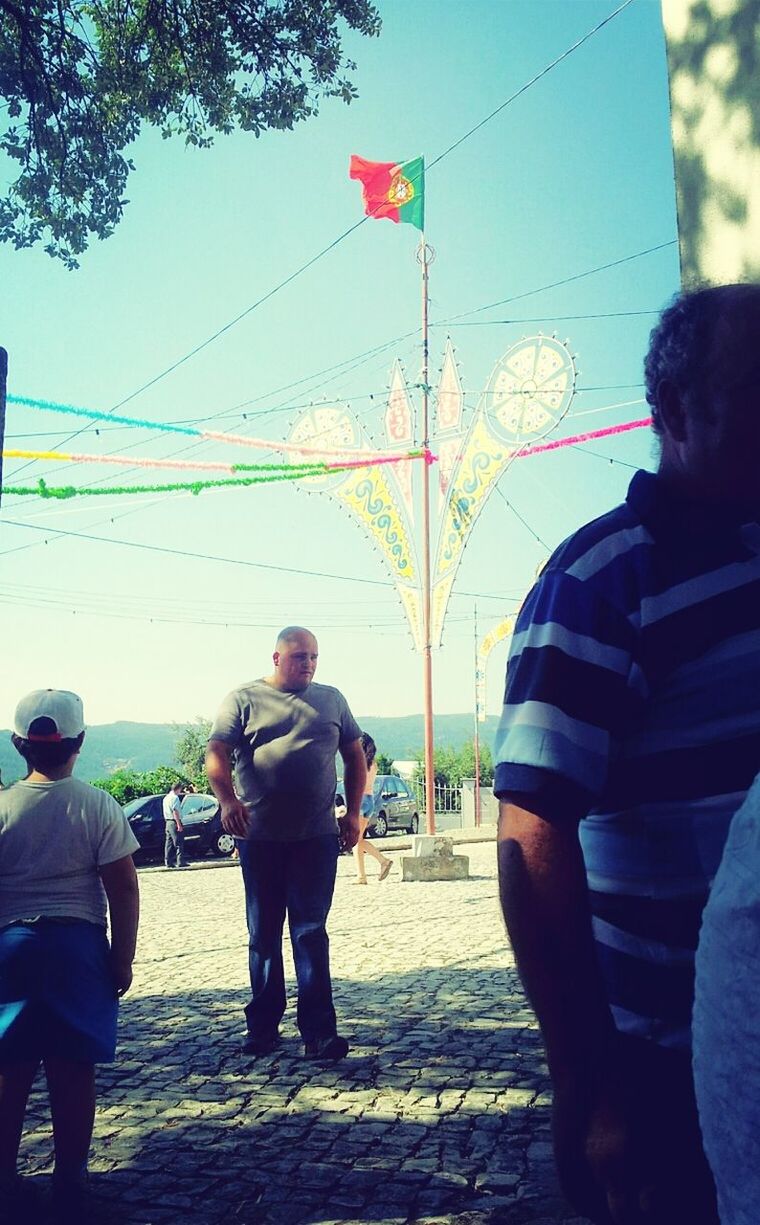 lifestyles, men, leisure activity, walking, rear view, person, full length, casual clothing, standing, street, building exterior, large group of people, sky, umbrella, built structure, architecture, medium group of people, togetherness