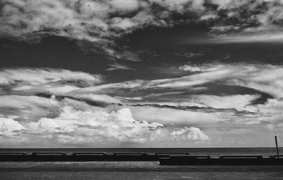 Scenic view of sea against cloudy sky