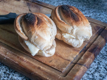 High angle view of bread on cutting board