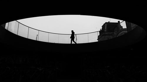 Silhouette man standing against clear sky